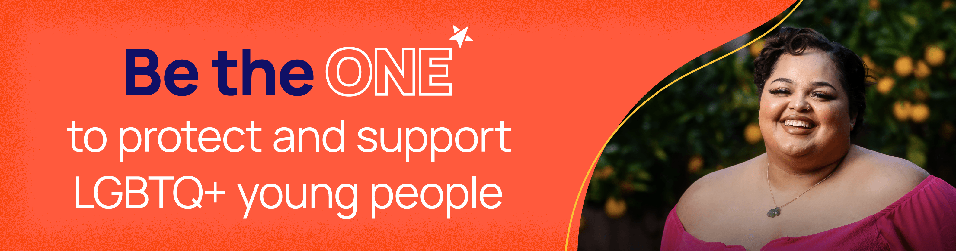 A young person smiling into the camera. Be the one to protect and support LGBTQ+ young people.