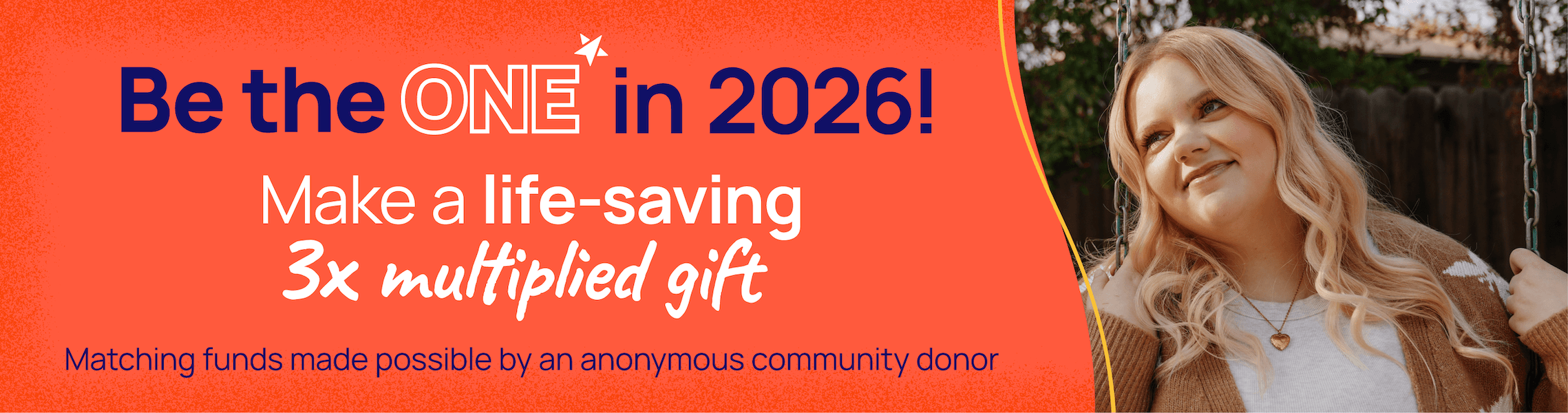 A young person sitting on a swing, holding the metal handles, smiling at the camera,            